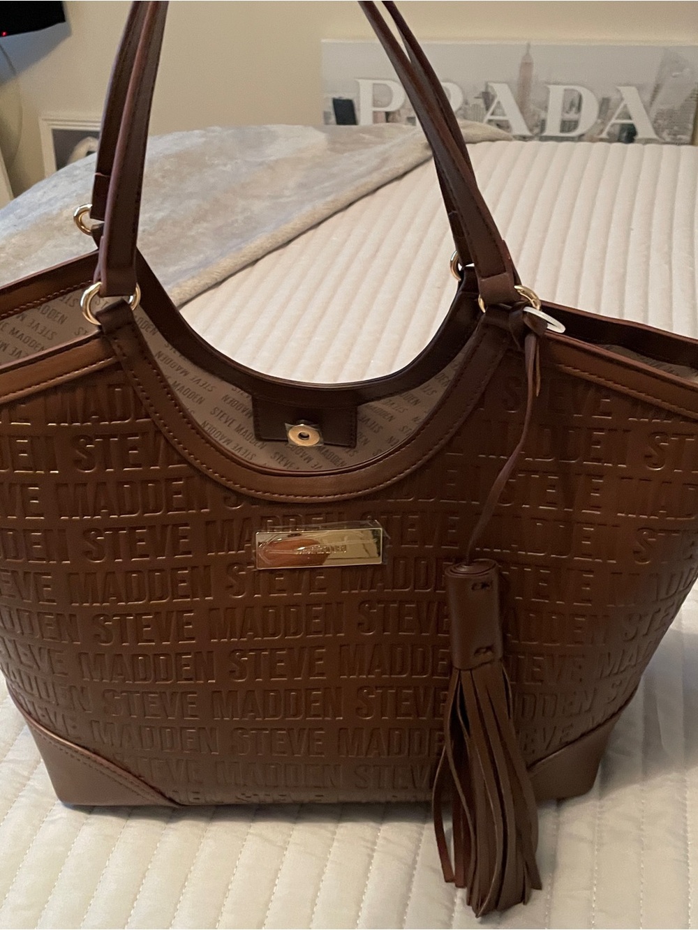 Steve Madden Brown Embossed Logo Tote with Tassel Charm